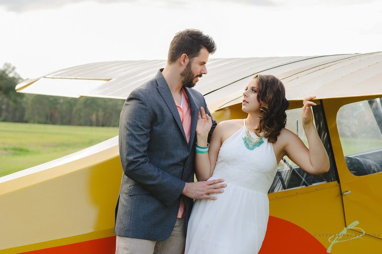 Airplane engagement session in field