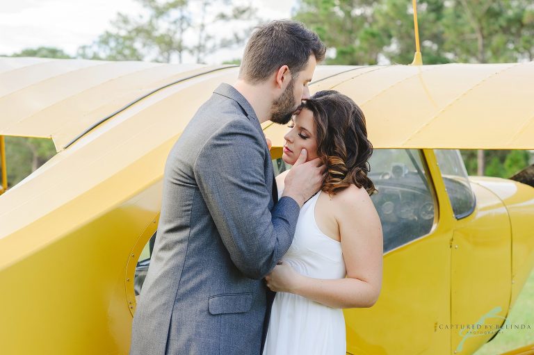 Airplane engagement session in field