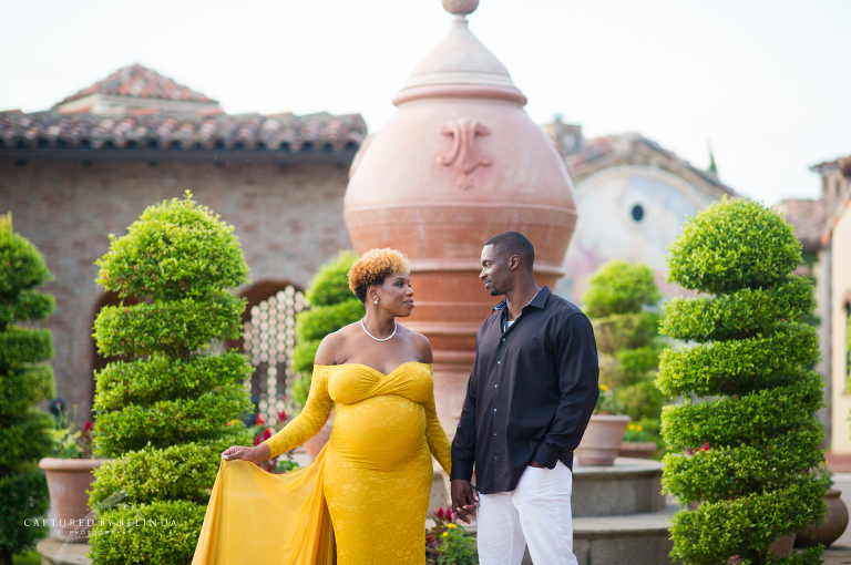 Deidra and Xan Pose for their maternity session in front of Bella Collina