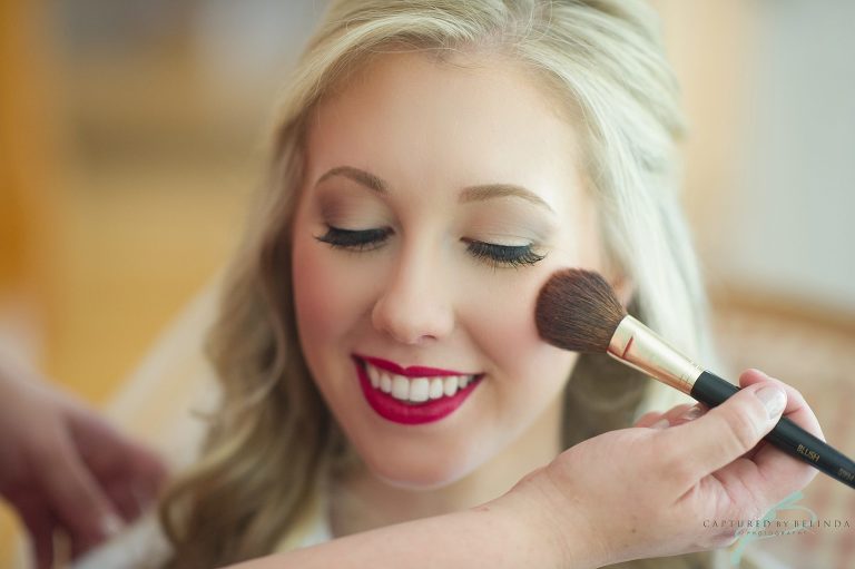 bride getting into her dress 