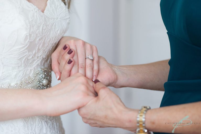 bride getting into her dress 