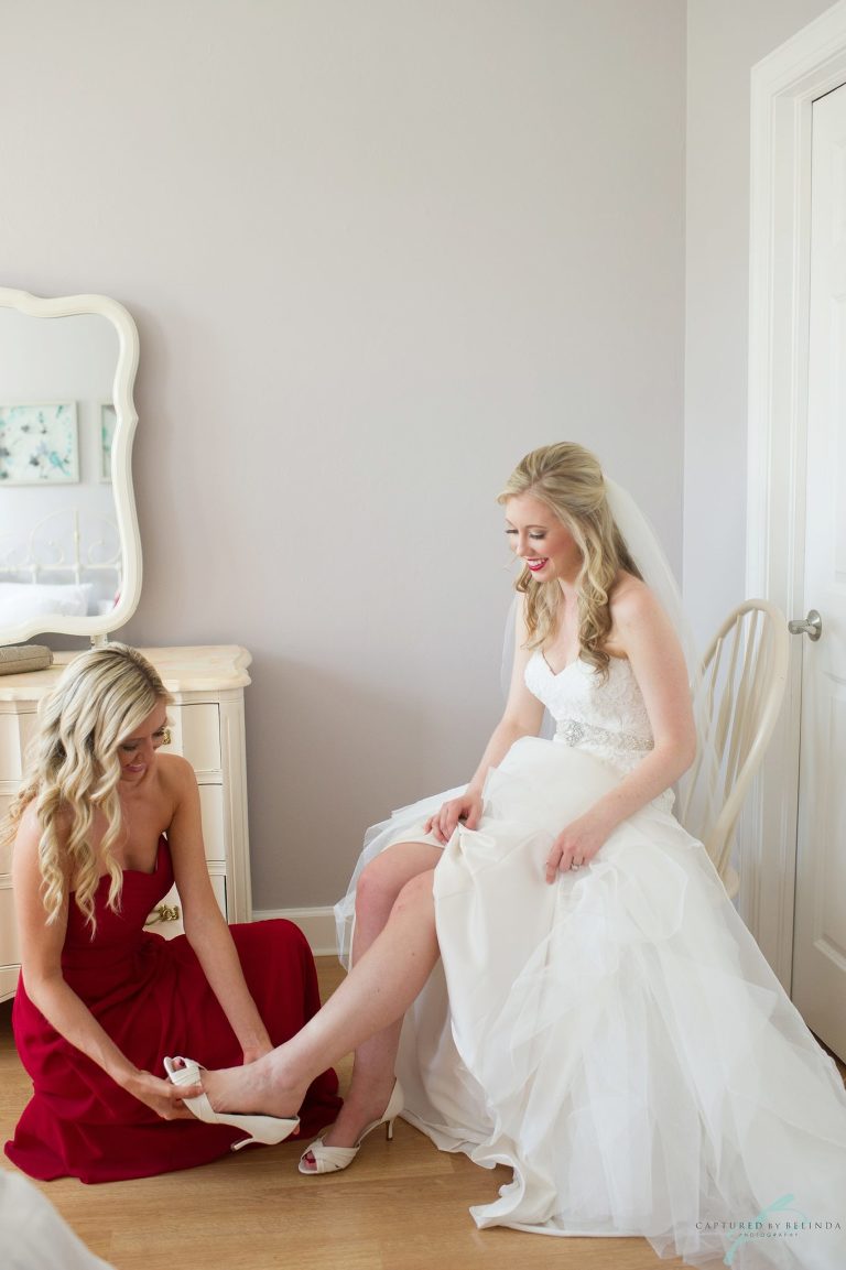 bride getting into her dress 